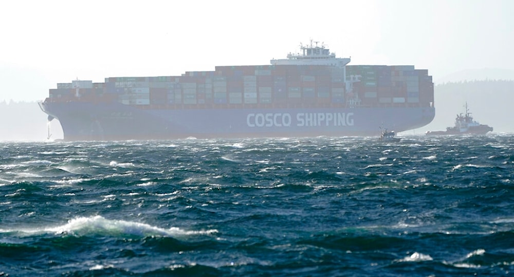 A Cosco Shipping cargo container boat is shown with its anchor out on rough seas in Elliott Bay, Tuesday, Oct. 13, 2020, in Seattle. (AP)