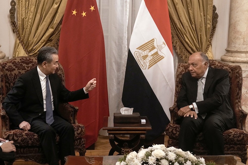 Egyptian Foreign Minister Sameh Shoukry, right, meets his Chinese counterpart Wang Yi at Tahrir palace in Cairo, Egypt, Sunday, Jan. 14, 2024. (AP)