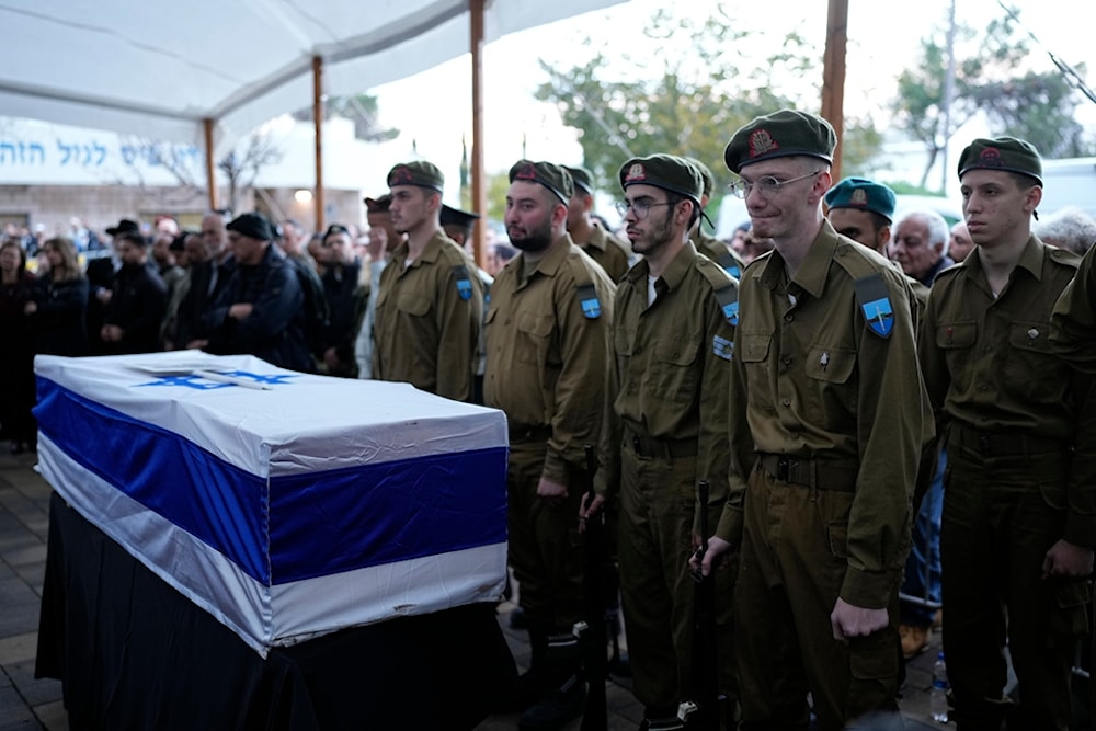 Israelis attend a funeral of Barak Ayalon and his 76-year-old mother, Mira, Monday, Jan. 15, 2024. (AP)