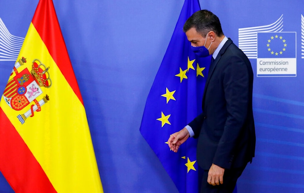 Spain's Prime Minister Pedro Sanchez walks by the EU flag prior to a meeting with European Commission President Ursula von der Leyen at EU headquarters in Brussels, Wednesday, Sept. 23, 2020. (AP)