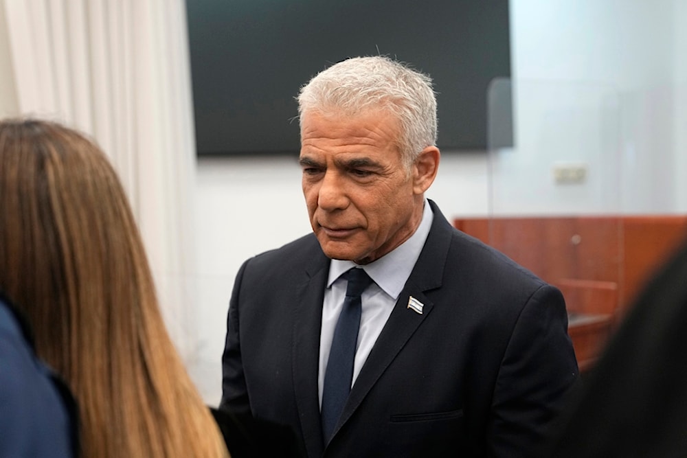 Israeli opposition leader Yair Lapid arrives to testify at the trial of Israeli occupation Prime Minister Benjamin Netanyahu on corruption charges, in occupied al-Quds, Palestine, June 12, 2023. (AP)
