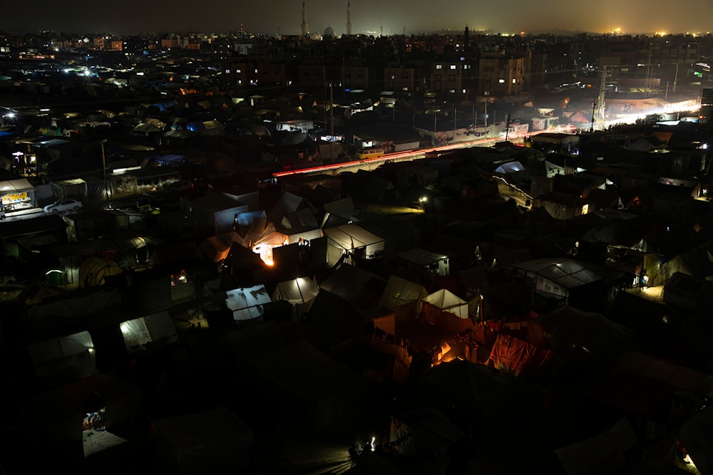 A view of the makeshift tent camp where Palestinians displaced by the Israeli bombardment of the Gaza Strip are staying, in the Mouwasi area on Sunday, Dec. 31, 2023. (AP)