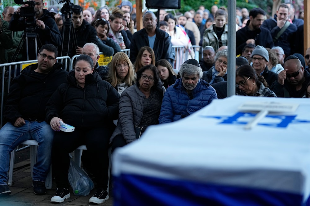 Israelis attend a funeral of an Israeli soldier in 'Mevo'ot HaHermon' Regional Council in occupied Palestine, January 15, 2024 (AP)