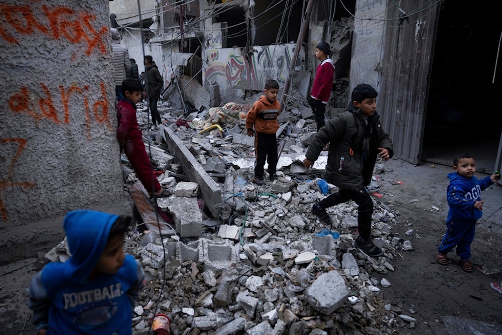 Palestinians look at the destruction after an Israeli strike in Rafah, southern Gaza Strip, Wednesday, Jan. 17, 2024. (AP)