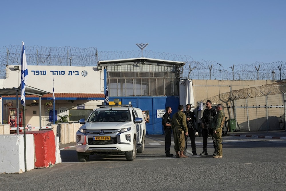 Israeli soldiers stand outside Ofer military prison near occupied Al-Quds on Friday, Nov. 24, 2023. (AP)