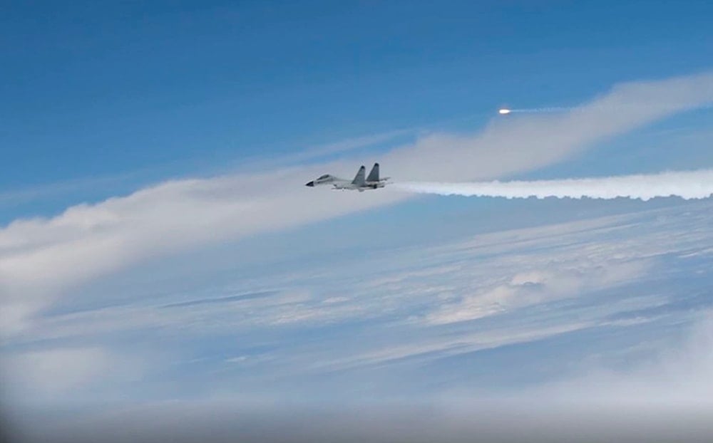 This image from video provided by the US Department of Defense, shows an intercept of a US warplane by Chinese aircraft in the Pacific Ocean on April 29, 2022 (AP)