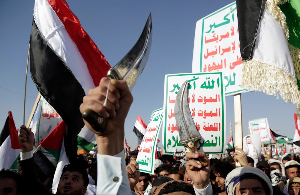 Ansar Allah supporters attend a protest against the United States-led airstrikes on Jan 12, 2024, in Sanaa, Yemen (AP)