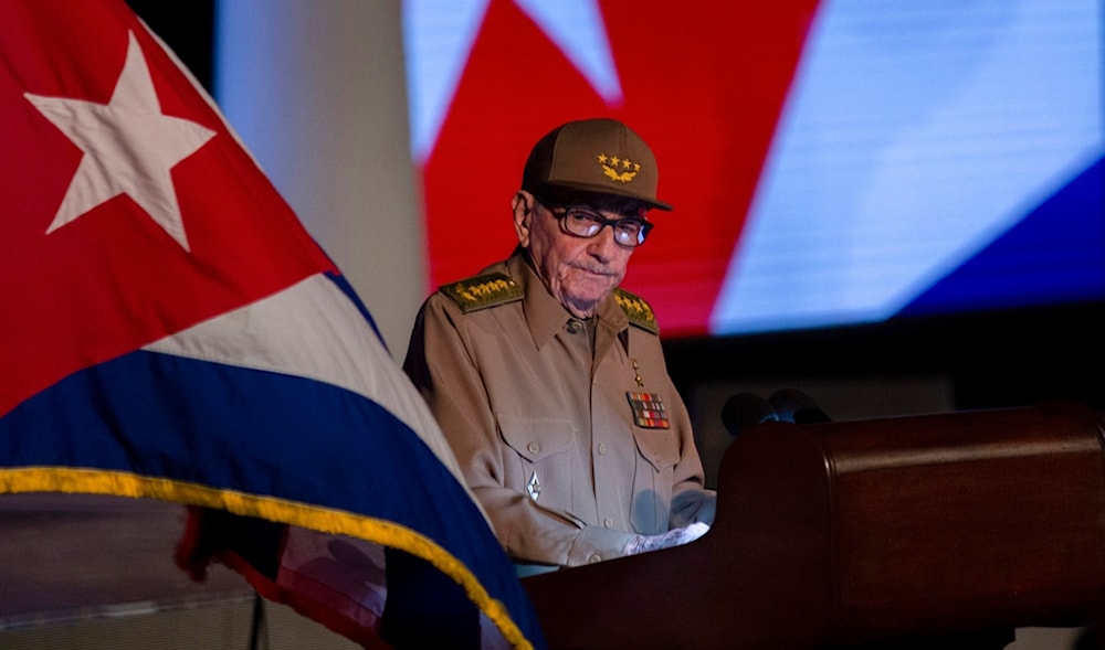 Former Cuban President Raul Castro looks at the Cuban flag during his speech at the event celebrating the 65th anniversary of the triumph of the revolution in Santiago, Cuba, Monday, Jan. 1, 2024. (AP)