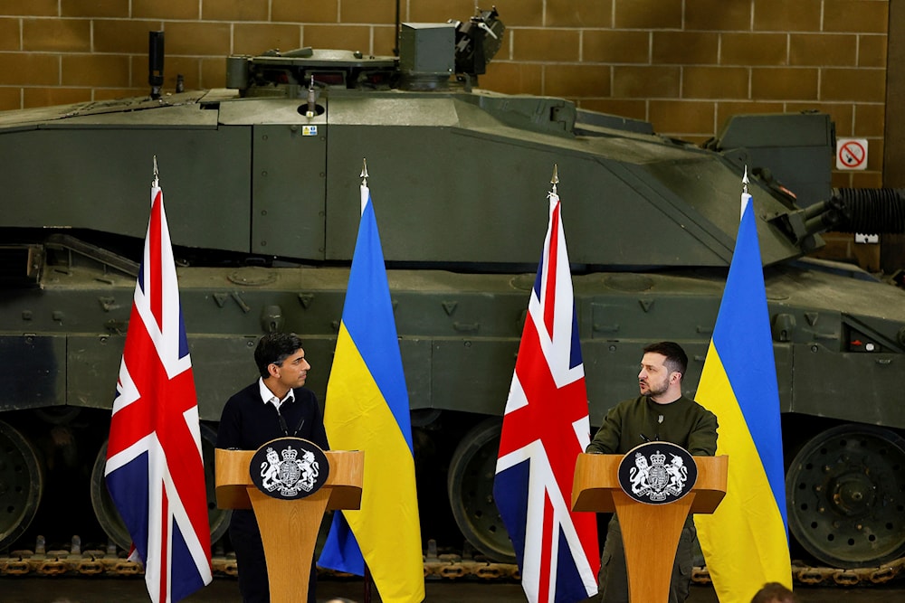 Britain's Prime Minister Rishi Sunak, left, and Ukrainian President Volodymyr Zelensky during a press conference at a military facility, in Lulworth, Dorset, England, Wednesday Feb. 8, 2023. (AP)