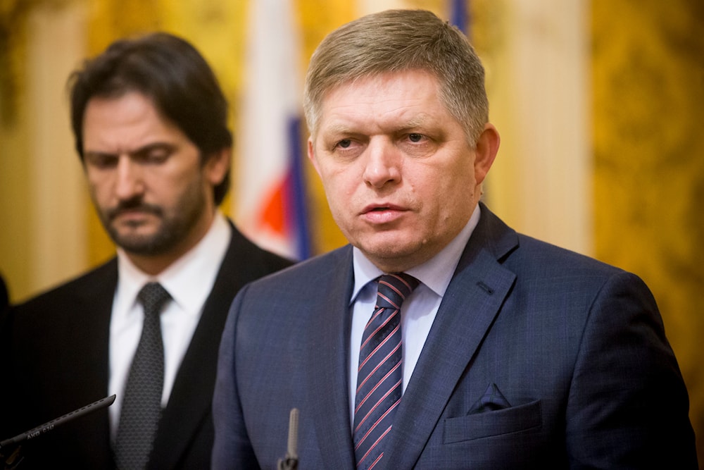 In this Wednesday, Feb. 28, 2018 file photo, Slovak Prime Minister Robert Fico, right, gives a media statement, with Minister of Interior Robert Kalinak, left, in Bratislava, Slovakia. (AP)
