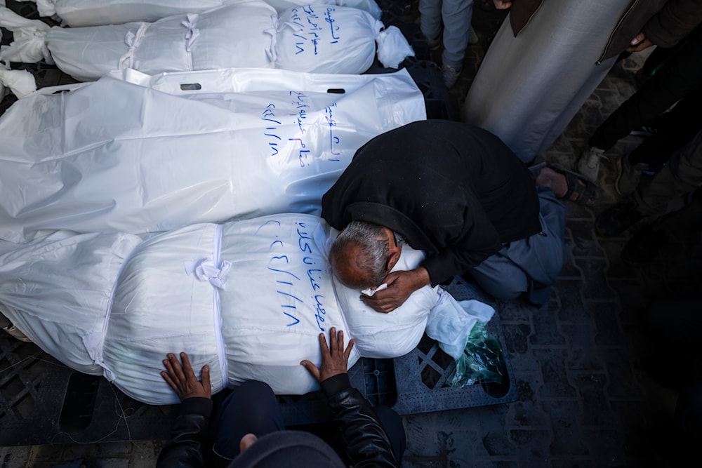 Palestinians mourn their relatives killed in the Israeli bombardment of the Gaza Strip, outside a morgue in Rafah, southern Gaza, Thursday, Jan. 18, 2024. (AP)