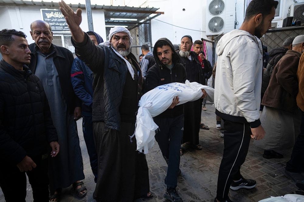 Palestinians mourn their relatives killed in the Israeli occupation's bombardment of the Gaza Strip, outside a morgue in Rafah, southern Gaza, occupied Palestine, Thursday, Jan. 18, 2024. (AP)