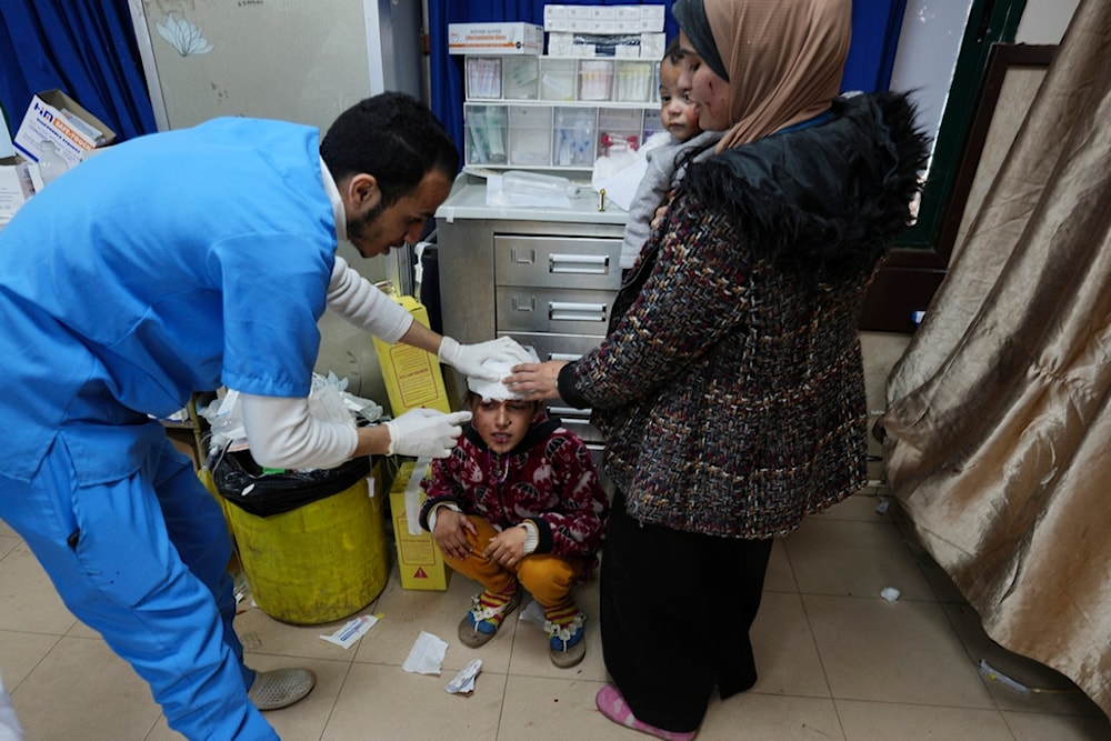 A Palestinian child wounded in an Israeli airstrike is brought to Al Aqsa Hospital in Deir al Balah, Gaza Strip, occupied Palestine, on Thursday, Jan. 11, 2024. (AP)