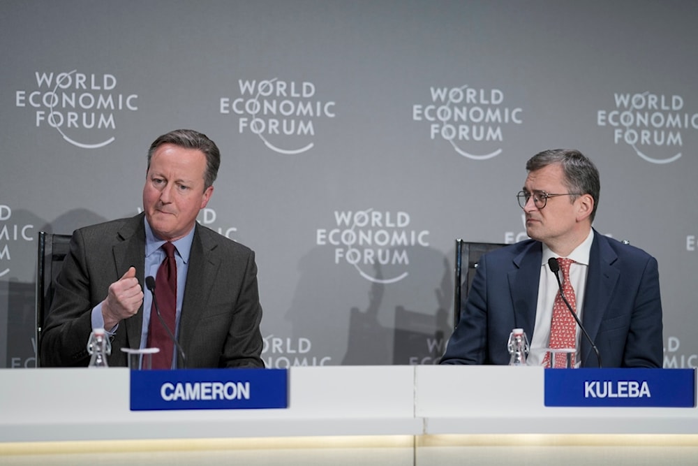 Britain's Foreign Secretary David Cameron, left, and Ukraine's Foreign Minister Dmytro Kuleba take part in a panel discussion at the Annual Meeting of World Economic Forum in Davos, Switzerland, Wednesday, Jan. 17, 2024. (AP)