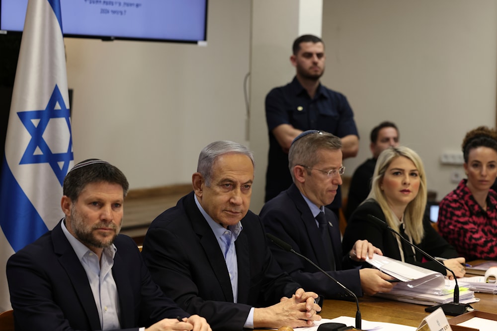 Israeli Prime Minister Benjamin Netanyahu, second left, attends the weekly cabinet meeting at the Security Ministry in 'Tel Aviv', occupied Palestine, January 7, 2024 (AP)