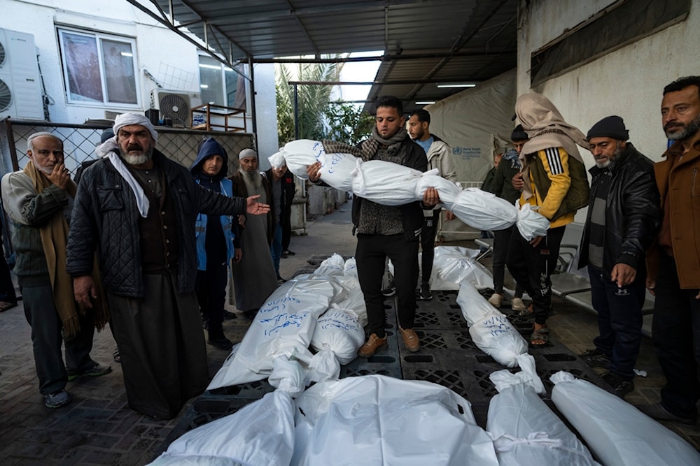 Palestinians mourn their relatives killed in the Israeli bombardment of the Gaza Strip, outside a morgue in Rafah, southern Gaza, Thursday, Jan. 18, 2024. (AP)