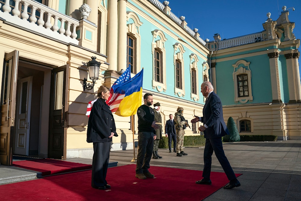 President Joe Biden, right, meets with Ukrainian President Volodymyr Zelenskyy, center, and Olena Zelenska, left, spouse of President Zelenskyy, at Mariinsky Palace during an unannounced visit in Kyiv, Ukraine, Monday, Feb. 20, 2023(AP)
