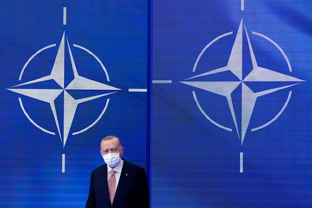 Turkish President Recep Tayyip Erdogan arrives to pose for photos with NATO Secretary General Jens Stoltenberg at the NATO summit at NATO headquarters in Brussels, Monday, June 14, 2021. (AP )