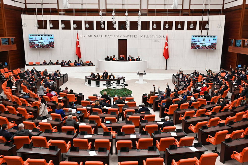 Turkish lawmakers follow the debate of Sweden's bid to join NATO at the Turkish Parliament in Ankara, Turkey, Tuesday, Jan. 23, 2024 (AP)