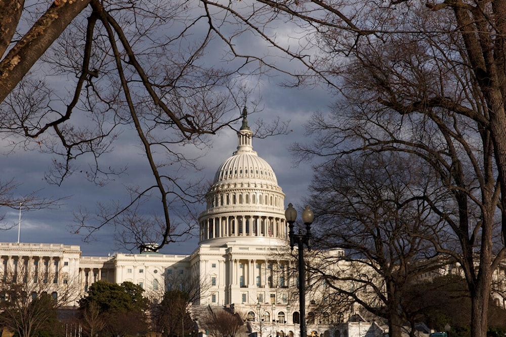 U.S. Capitol as dark skies recede following blustery weather, Friday, Feb. 21, 2014, in Washington. (AP)