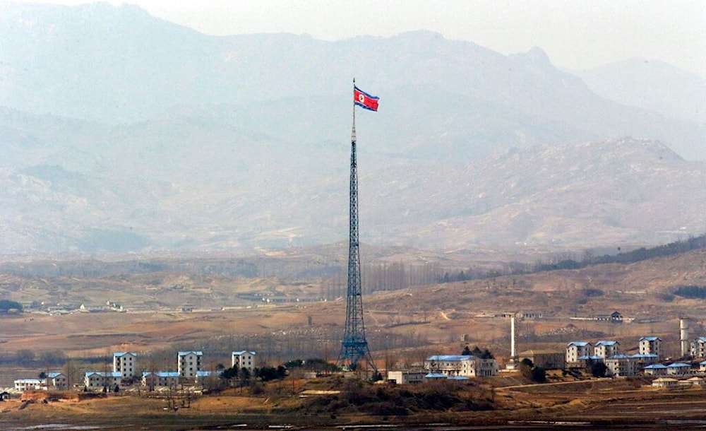 A DPRK flag is seen atop a 160-meter (533-foot) tower in the village of Gijungdong near the north side of the border village of Panmunjom, 