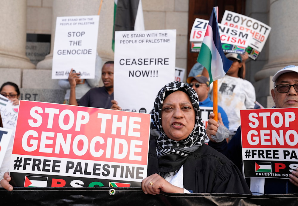 Pro-Palestinian supporters picket outside the High Court in Cape Town, South Africa, January 11, 2024 (AP)