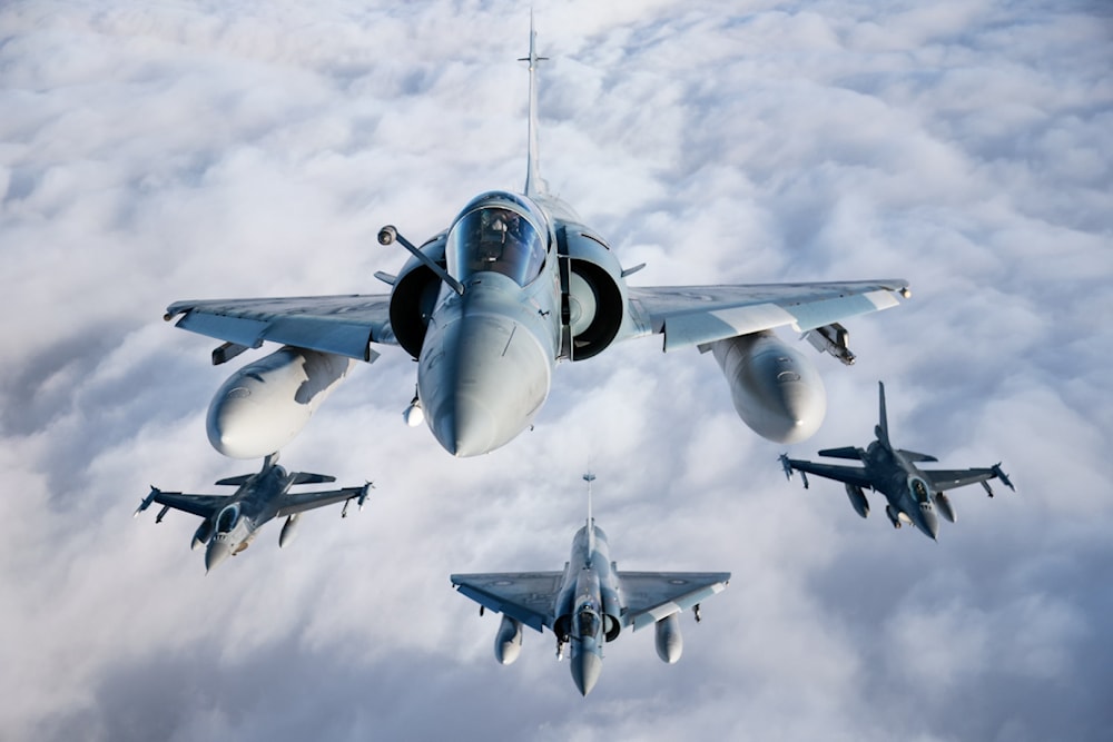 F-16, Mirage 2000 and C-27 flew training missions above Lithuania, conducting close formation flights and aerial combat drills to demonstrate capabilities and hone flying skills