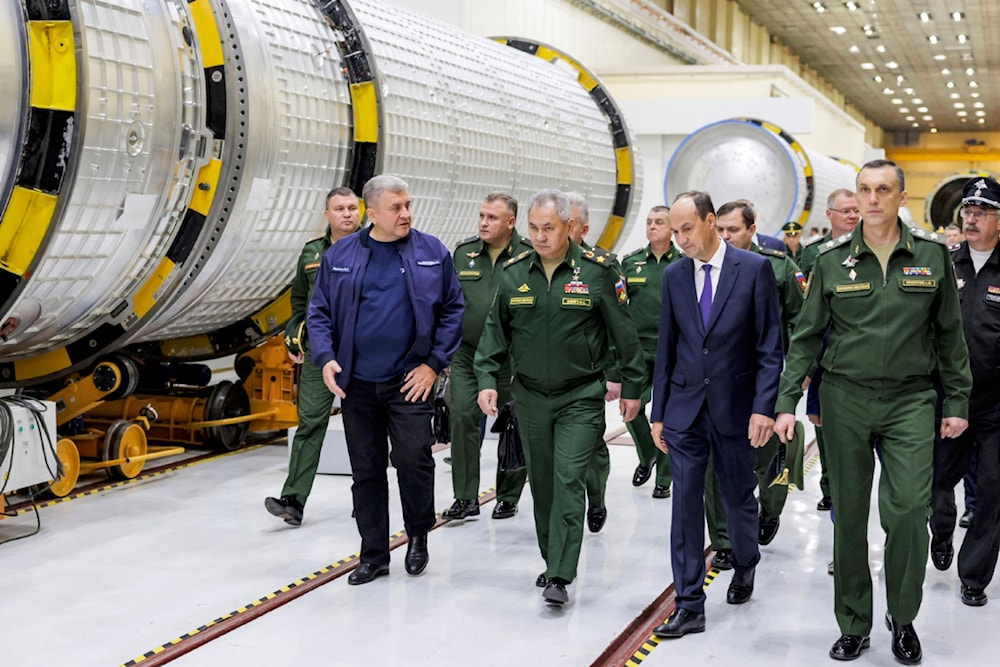  In this photo released by Russian Defense Ministry Press Service on Saturday, Oct. 7, 2023, Russian Defense Minister Sergei Shoigu, center, inspects fulfilment of the state defense order in Russia. (AP)