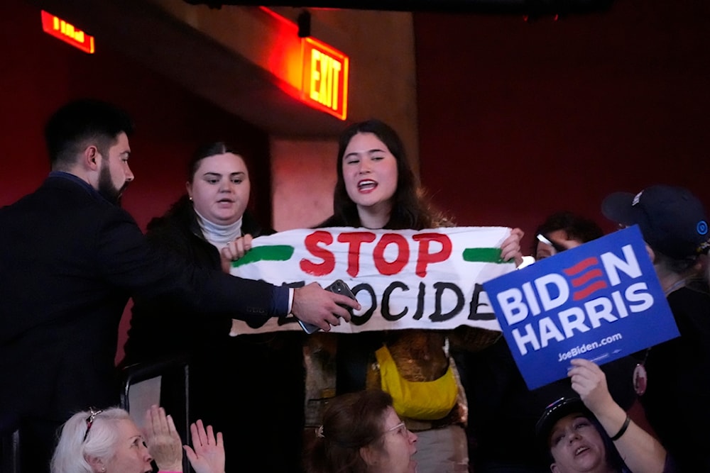 A protester interrupts President Joe Biden during an event on the campus of George Mason University in Manassas, Va., Tuesday, Jan. 23, 2024 (AP)