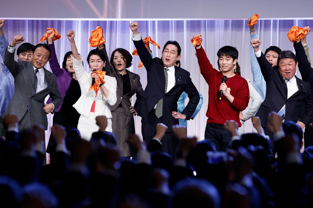 Japan's prime minister and president of the Liberal Democratic Party (LDP), raises his fist with the vice president of the LDP, secretary general of the LDP, and other party members during the party's annual convention in Japan, on Feb. 26, 2023(AP) 