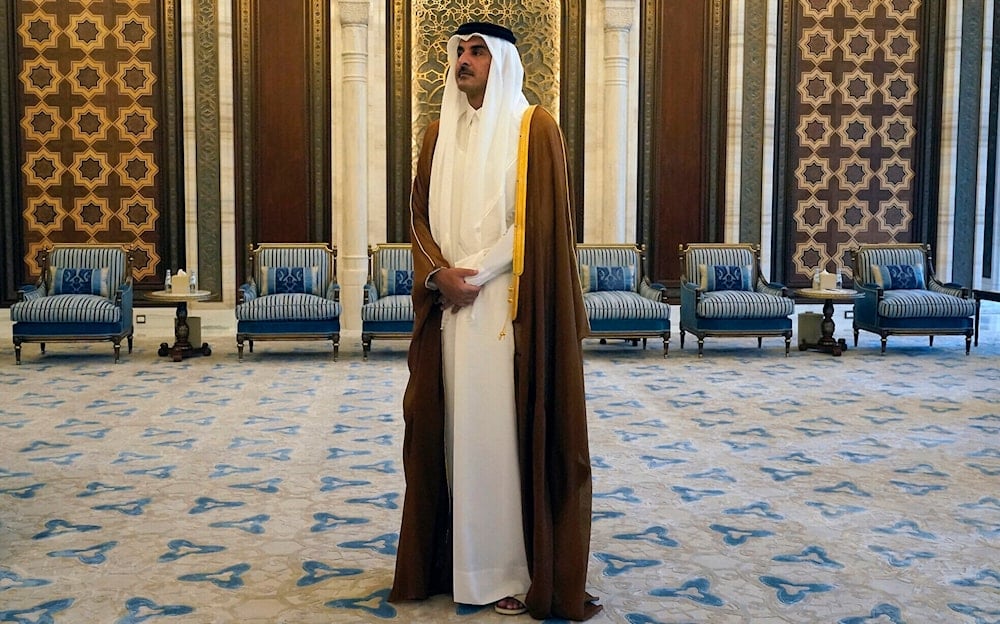 Qatar's Emir Sheikh Tamim bin Hamad al-Thani looks on as he waits for US Secretary of State Antony Blinken in Lusail on October 13, 2023. (AFP)