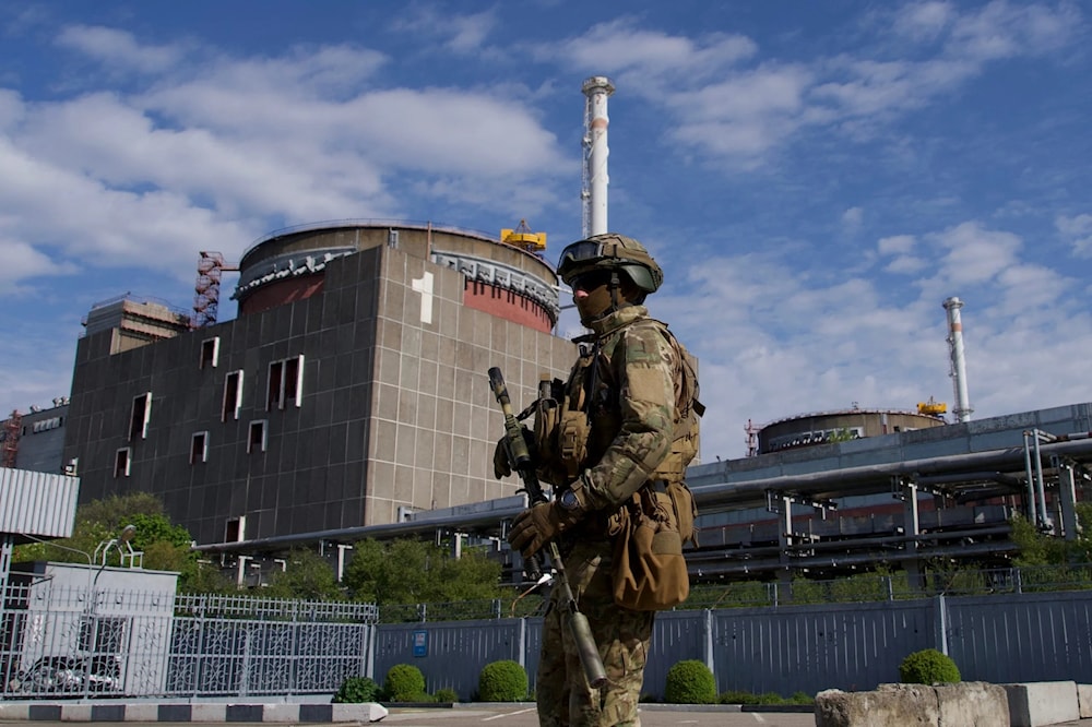 A Russian soldier patrols outside the Zaporizhzhia Nuclear Power Plant in Ukraine on May 1, 2022. (AFP)