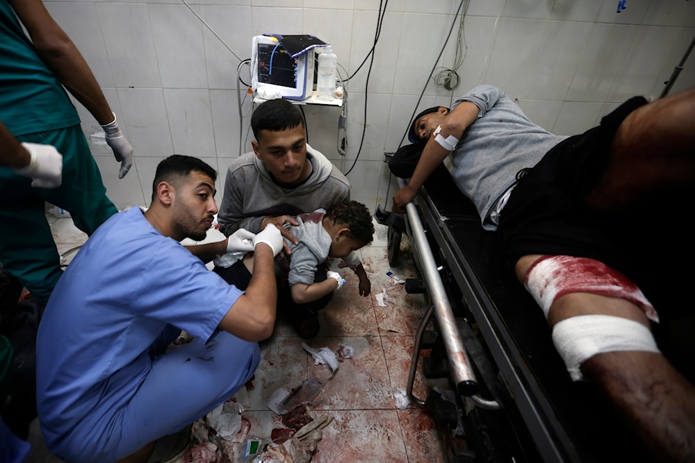Palestinians wounded in the Israeli bombardment of the Gaza Strip receive treatment at the Nasser Hospital in Khan Younis, Southern Gaza Strip, occupied Palestine, January 22, 2024 (AP)