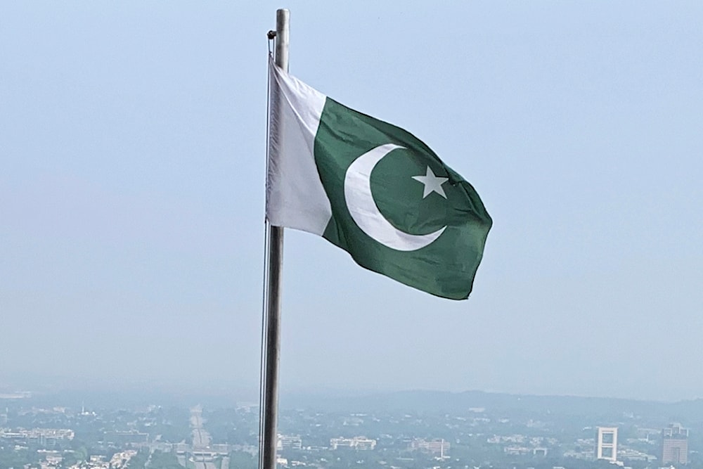 A Pakistani flag flies on a lookout in Islamabad, Pakistan, on July 27, 2022. (AP)