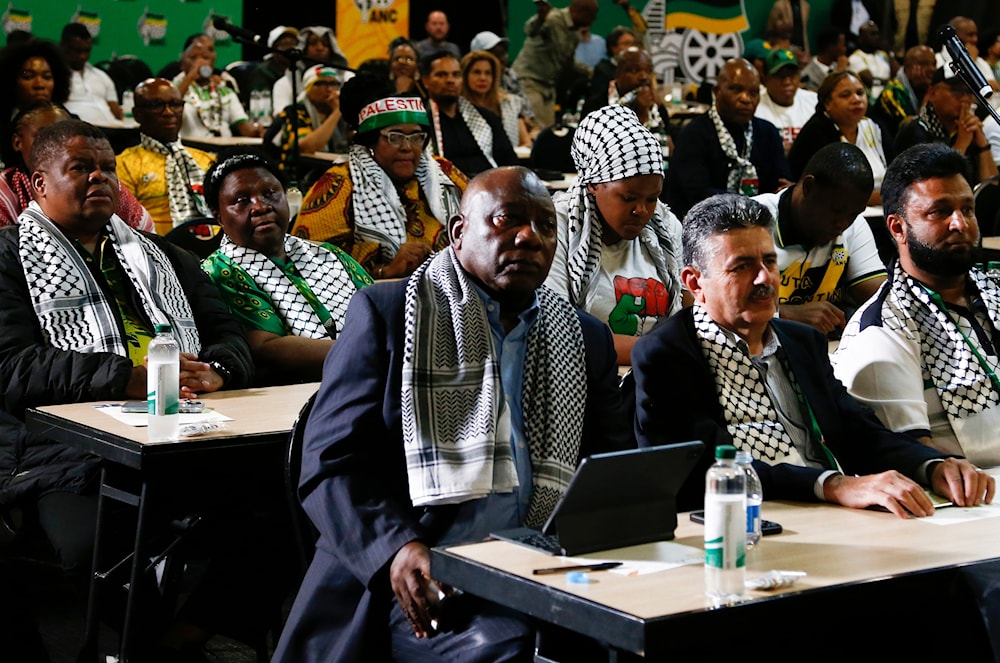 South African President Cyril Ramaphosa, first row left, listens in Johannesburg, January 26, 2024, to the ruling from the International Criminal Court (AP)