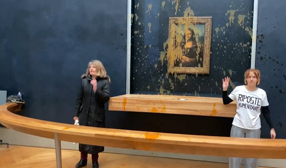 Two eco-activists throwing soup at the Mona Lisa in the Louvre (Screengrab from video posted on X)