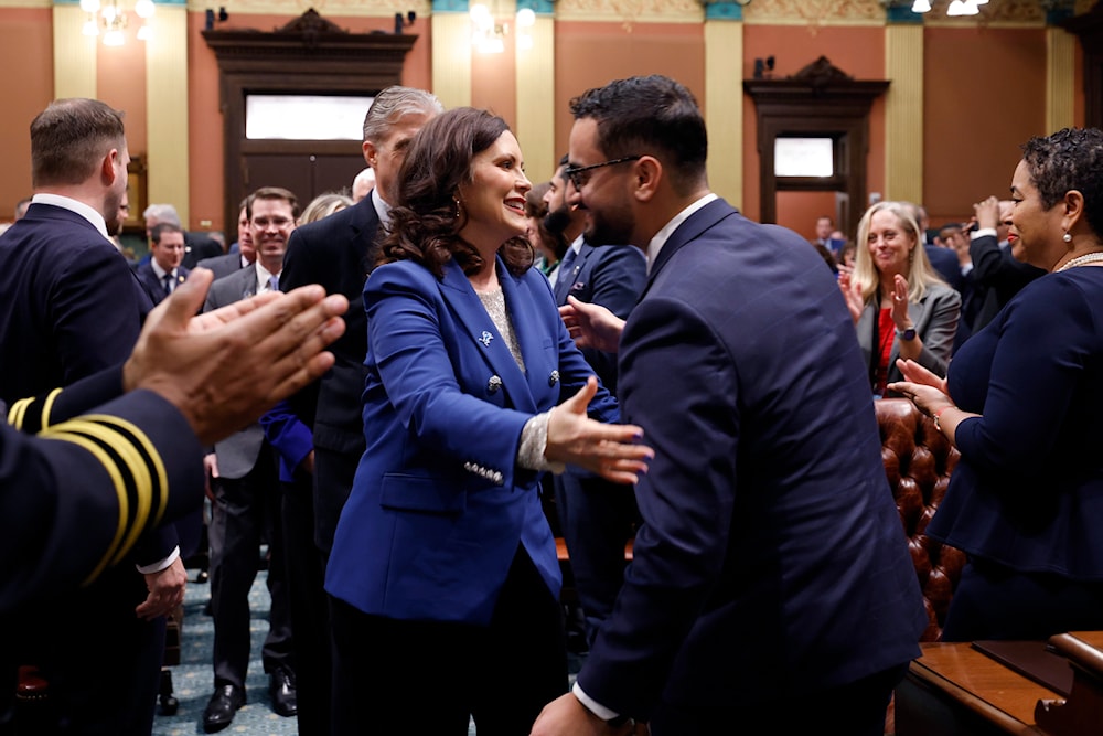 Michigan Gov. Gretchen Whitmer, greets state Rep. Abraham Aiyash, D-Hamtramck, before delivering her State of the State address to a joint session of the House and Senate, Wednesday, Jan. 24, 2024, at the state Capitol in Lansing, Mich.(AP)