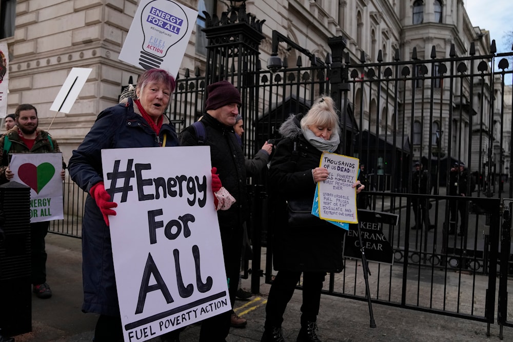 Protestors from Fuel Poverty Action group  demonstrate over the number of excess deaths in Britain due to pensioners unable to heat their homes in winter due to rising fuel costs outside Downing Street in London, on Jan. 19, 2023(AP)