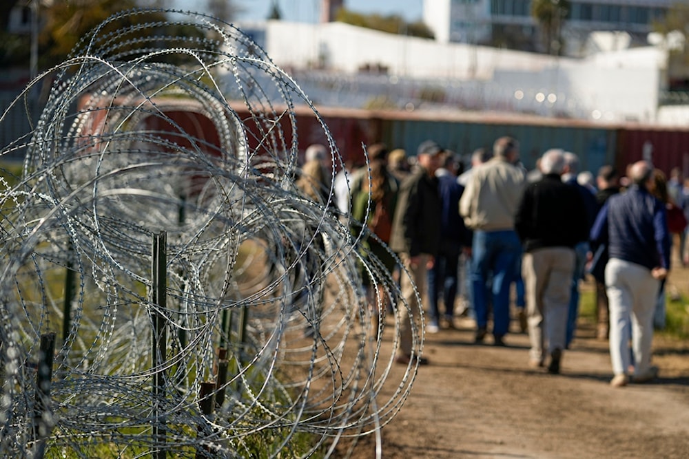 Concertina wire lines the path as members of Congress tour an area near the Texas-Mexico border, Jan. 3, 2024, in Eagle Pass, Texas.  (AP)