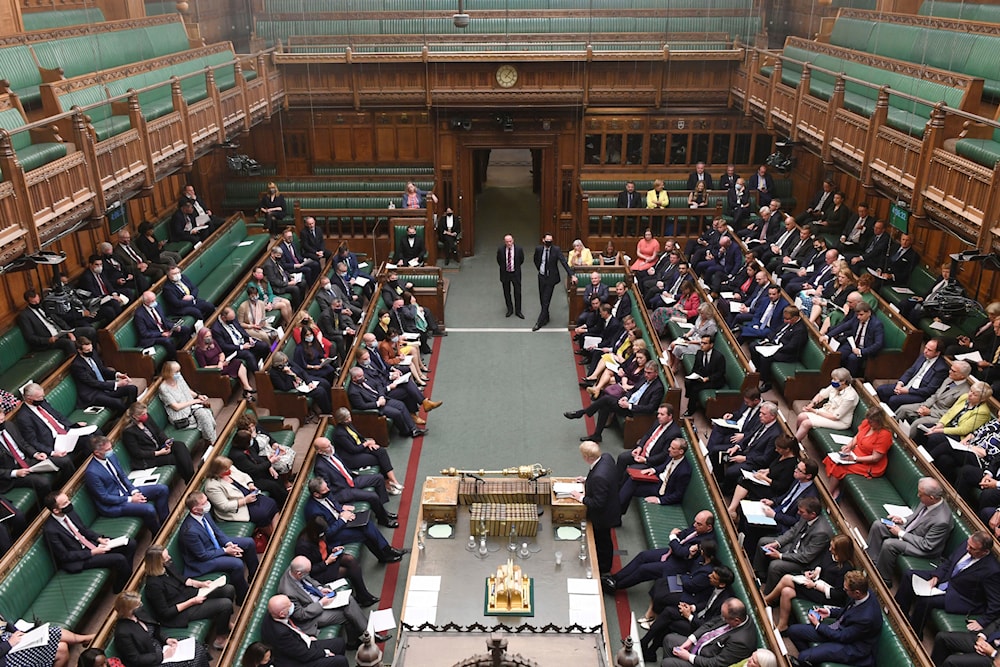 In this handout photo provided by the UK Parliament, MPs listen to Britain's Prime Minister Boris Johnson back then giving an update on the latest situation in Afghanistan in the House of Commons, London, Monday, Sept. 6, 2021(AP)