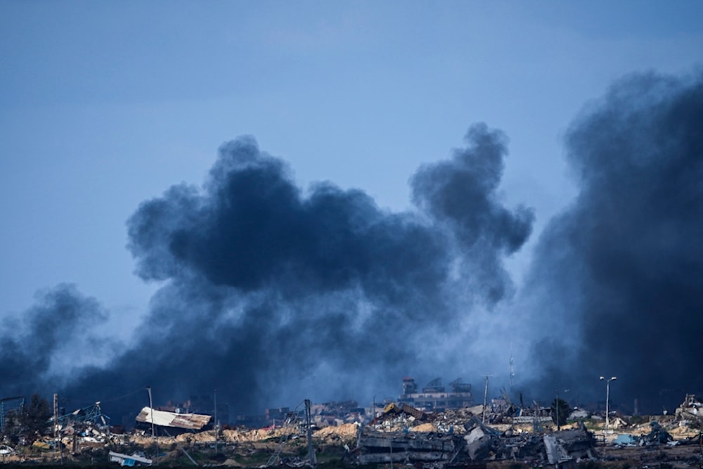 Smoke rises following an Israeli bombardment in the Gaza Strip, as seen from southern occupied Palestine, Tuesday, Jan. 30, 2024. (AP)