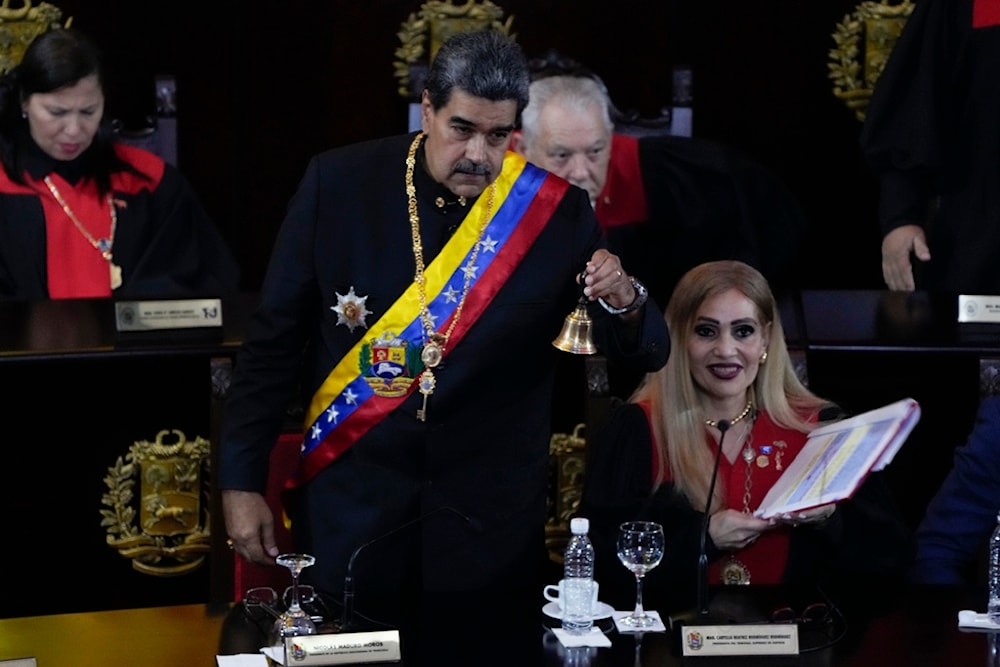 Venezuelan President Nicolas Maduro rings the bell at the end of a ceremony marking the new judicial year at the Supreme Court in Caracas, Venezuela, Wednesday, Jan. 31, 2024. (AP)