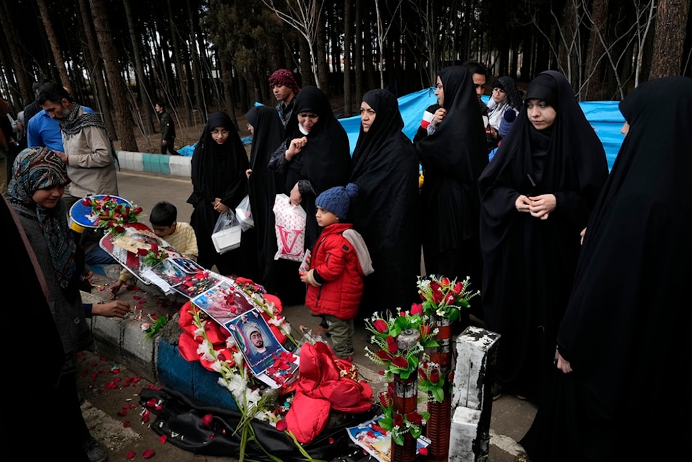 People visit the scene of Wednesday's bomb explosion in the city of Kerman 820 km (about 510 miles) southeast of Tehran, Iran, Thursday, Jan. 4, 2024. (AP)