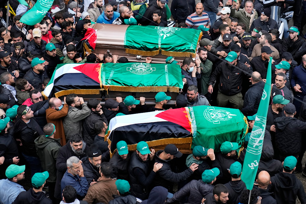 Mourners carry the coffins of Hamas deputy chief Saleh al-Arouri and two other Hamas members, who were killed in an Israeli strike Tuesday, during their funeral in Beirut, Lebanon, January 4, 2024 (AP)