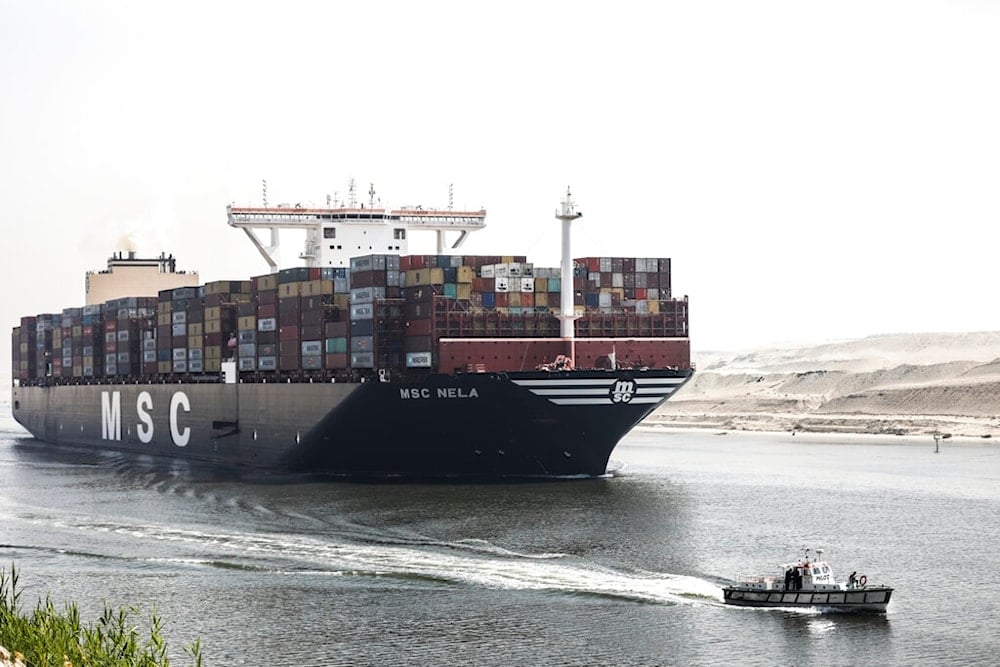 A container ship passes through Suez Canal, Egypt, Tuesday, April 6, 2021. (AP)