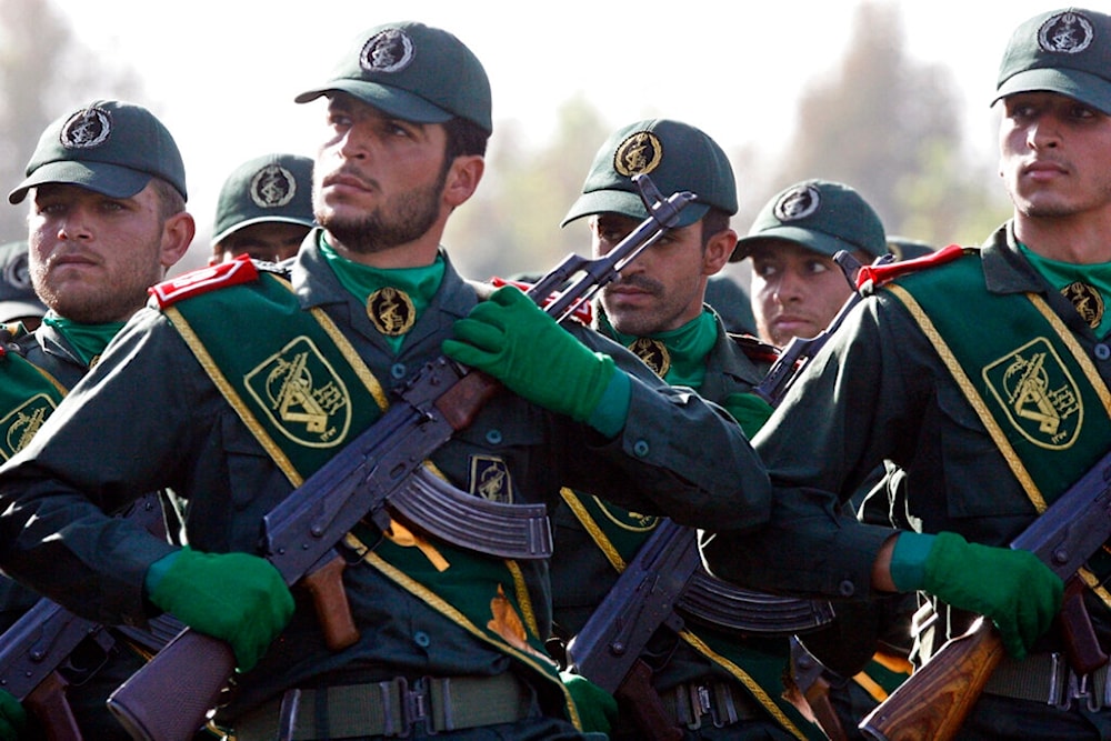  Iranian Islamic Revolution Guard members march during a parade ceremony marking the 28th anniversary of the onset of the Iran-Iraq war, Sunday, Sept. 21, 2008 (AP)