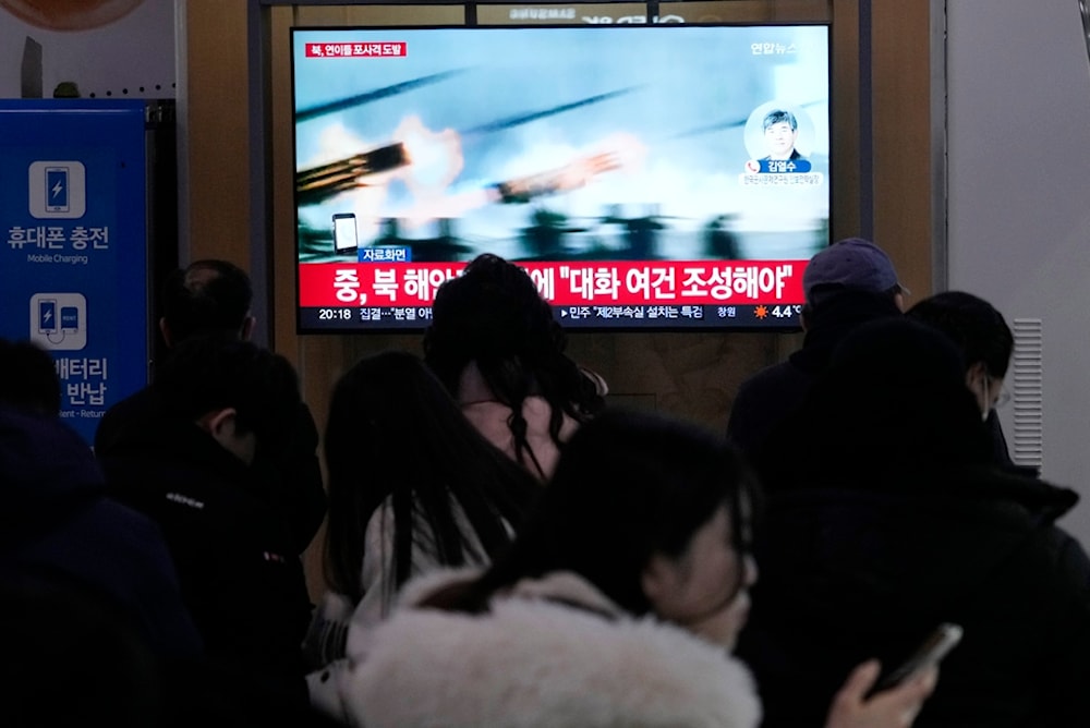 A TV screen shows a file image of North Korea's military exercise during a news program at the Seoul Railway Station in Seoul, South Korea, Saturday, Jan. 6, 2024 (AP)