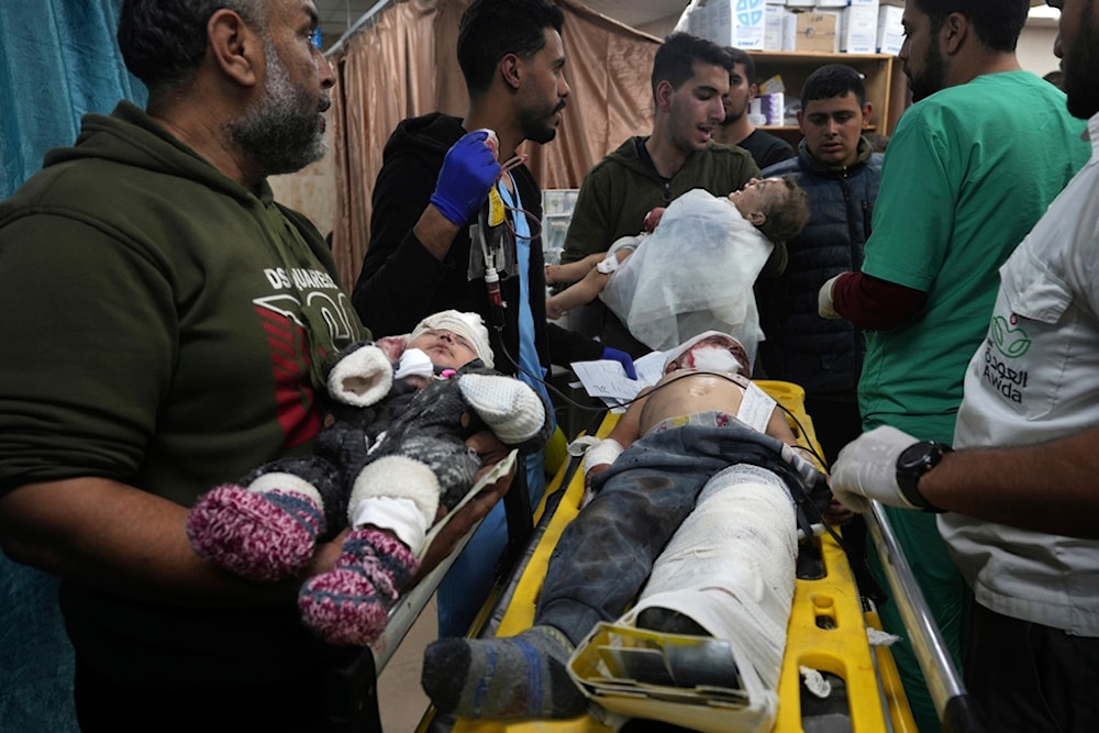 Palestinian children wounded in the Israeli bombardment of the Gaza Strip are brought to the hospital in Deir al Balah, Gaza Strip, occupied Palestine, on Monday, Dec. 11, 2023. (AP)