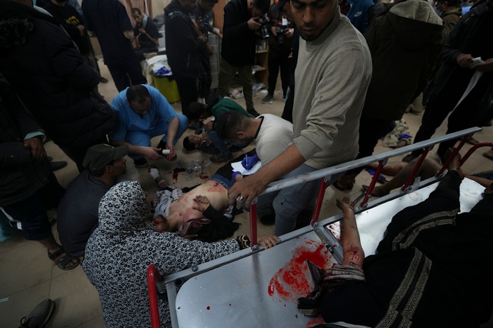 Palestinians wounded in the Israeli occupation bombardment of the Gaza Strip are brought to Al Aqsa hospital in Deir al Balah, Gaza Strip, Sunday, Jan. 7, 2024. (AP)