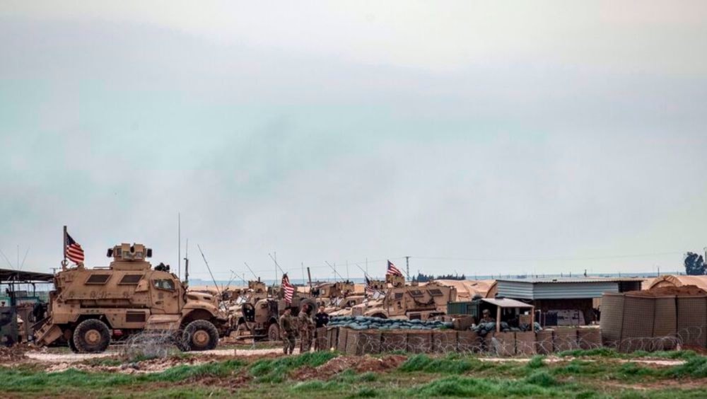 US soldiers and military vehicles at a base in Syria’s northeastern town of Rmelan on October 29, 2023. (AFP)